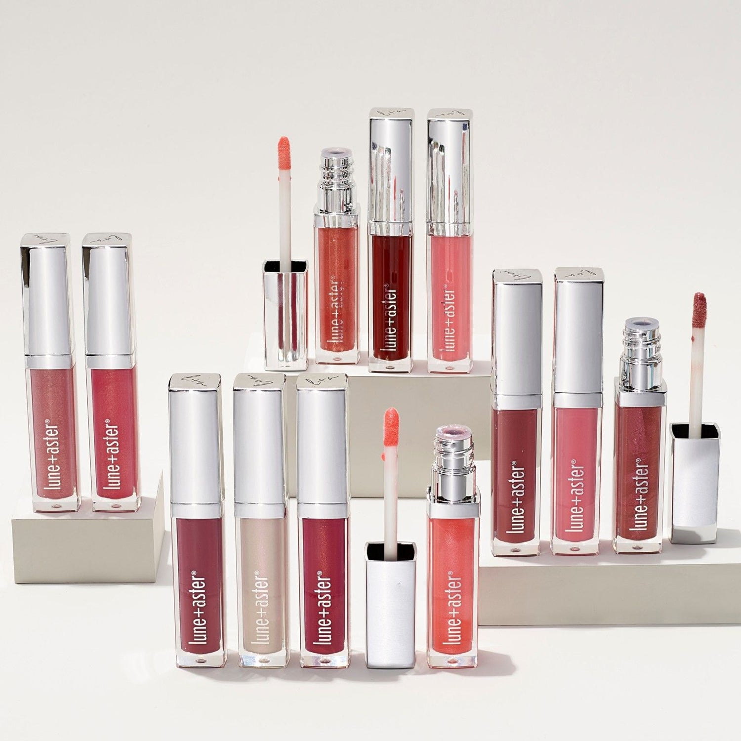 Lifestyle image of Lune+Aster Vitamin C+E Lip Gloss variant: Pomegranate