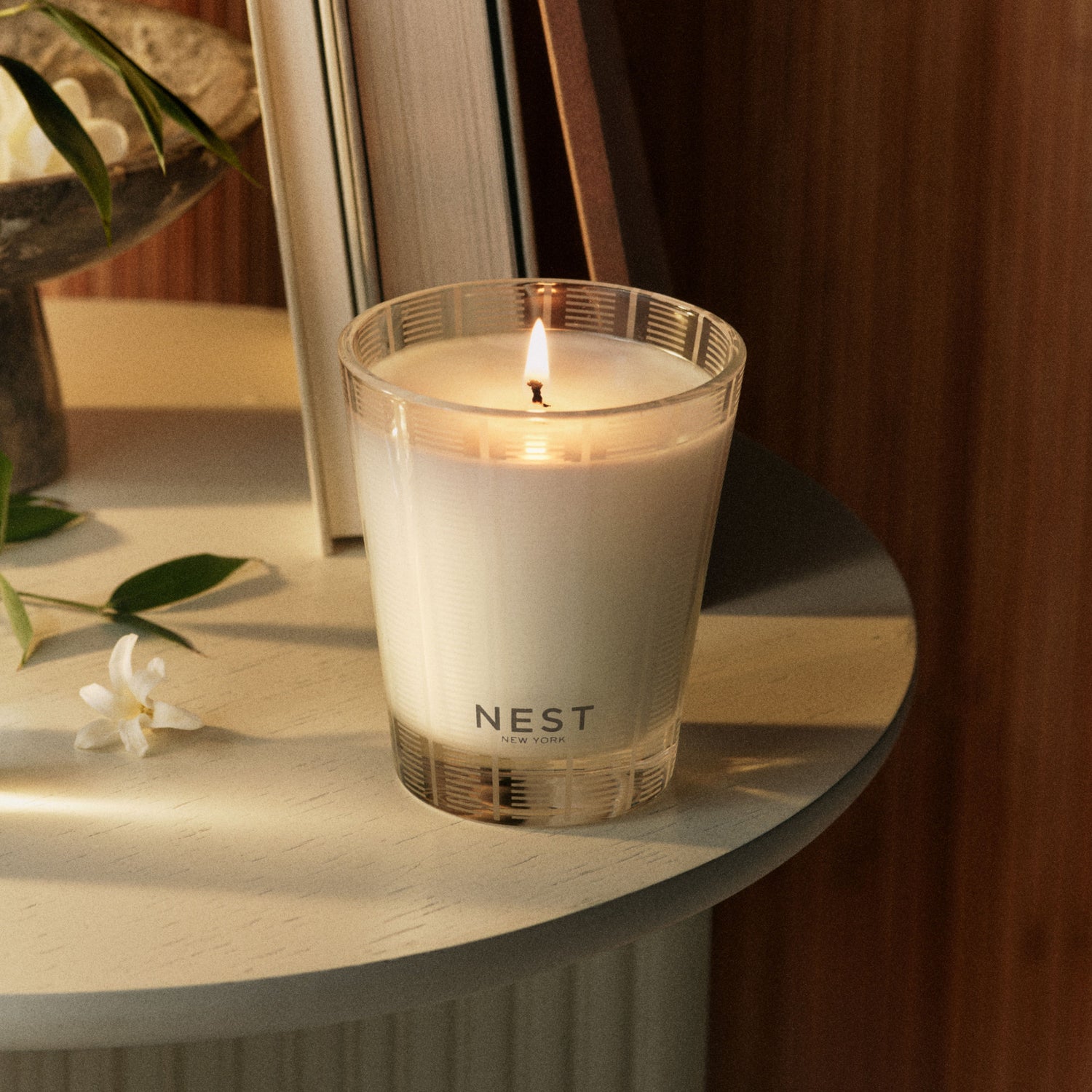 Lifestyle image of Nest Bamboo Candle variant: 8.1 oz (Classic)