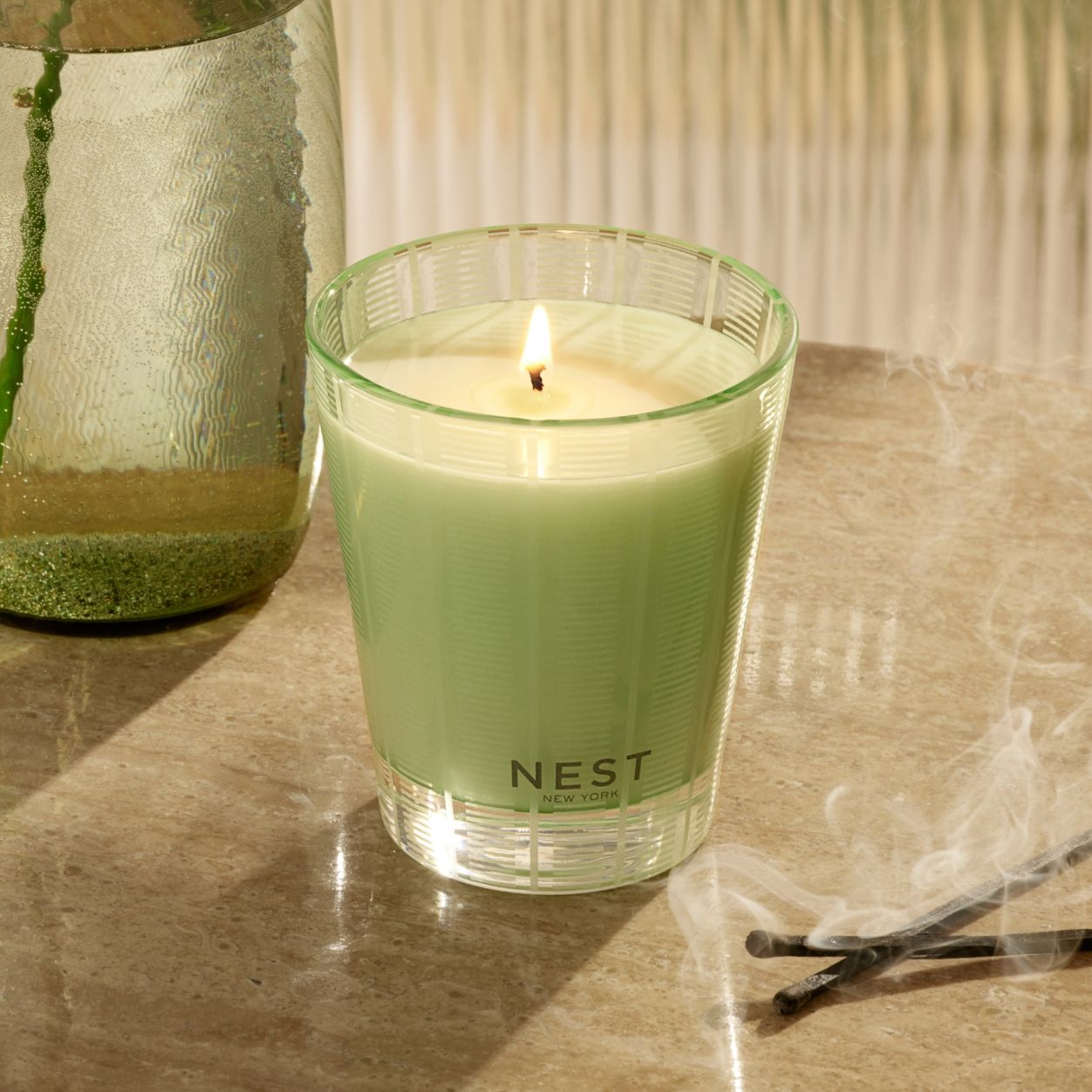 Lifestyle image of Nest Cucumber & White Sage Candle variant: 8.1 oz (Classic)