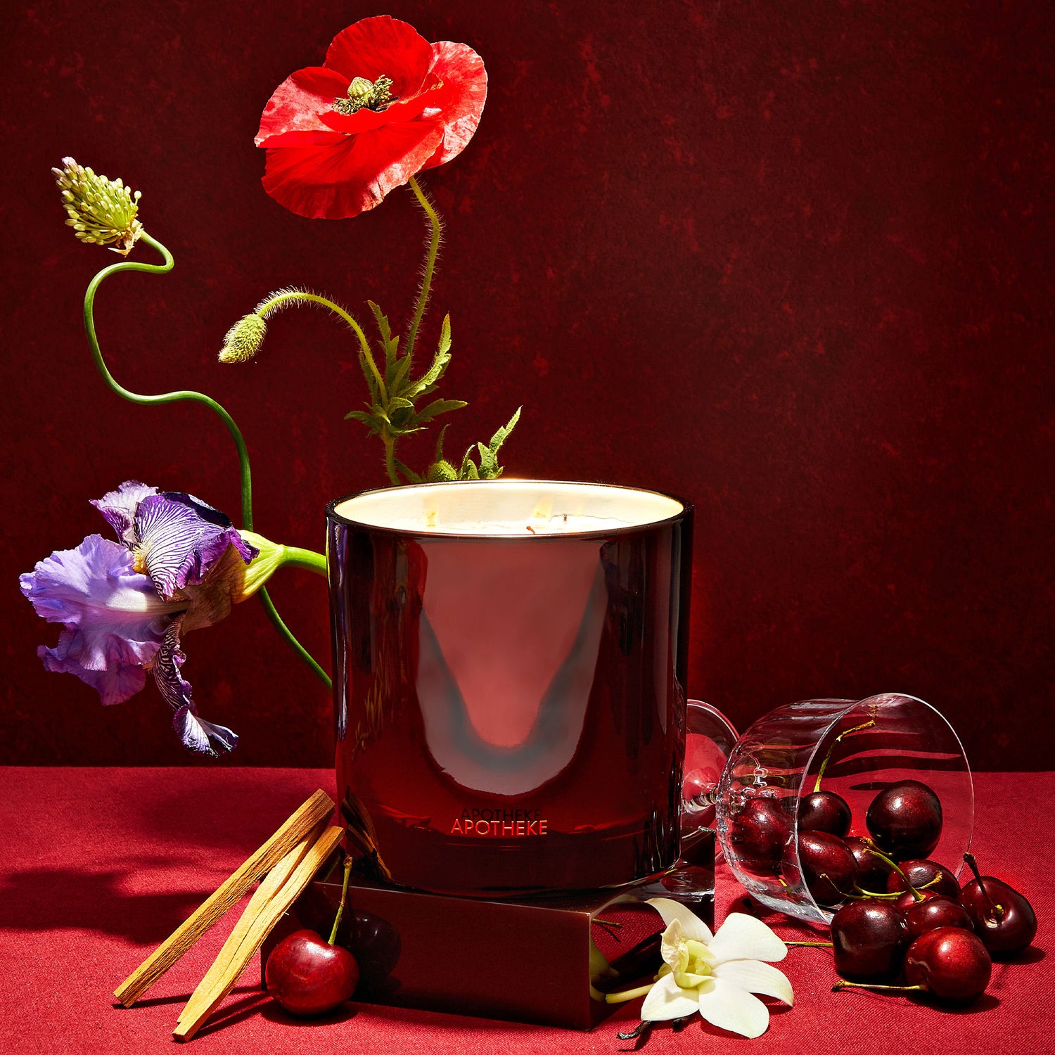 Lifestyle image of Apotheke Bitter Cherry Scented Candle (Limited Edition) variant: 26 oz (3 Wick)