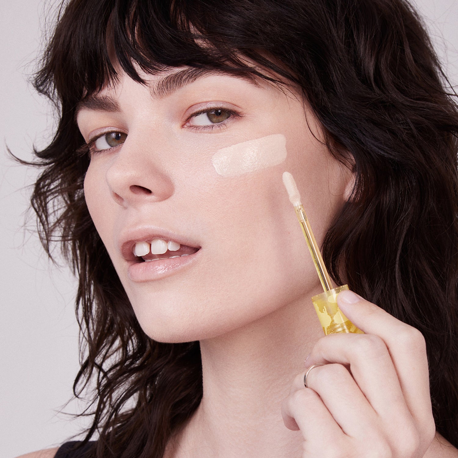 Kosas Revealer Concealer Color/Shade variant: Tone 0.5 N model image . This product is for light neutral beige complexions