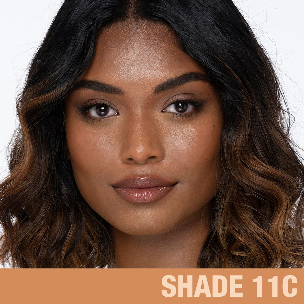 Model image of Charlotte Tilbury Charlotte's Beautiful Skin Foundation variant: 11 Cool (tan with red cool undertones)