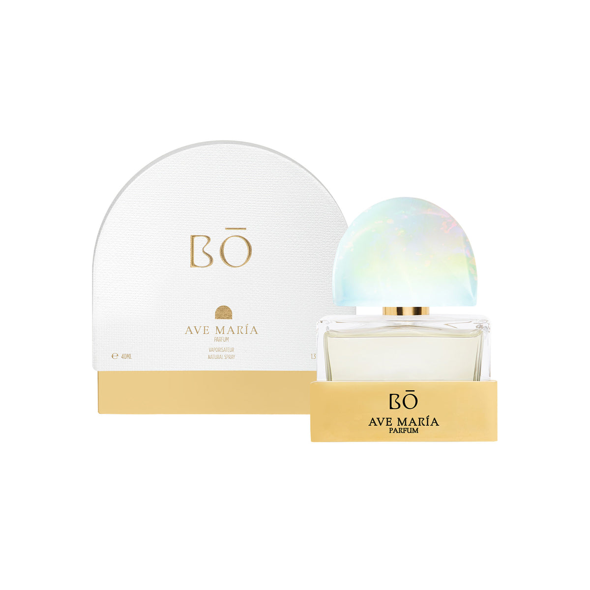 A rectangular Ave María Parfum bottle, embodying devotion, sits with its iridescent, semi-circular cap in front of an arched white and gold box.