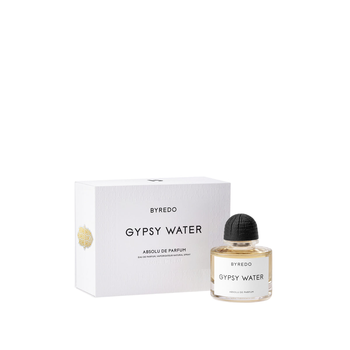A white rectangular Gypsy Water Absolu de Parfum woody fragrance box next to a round glass perfume bottle with a black cap and a white label.