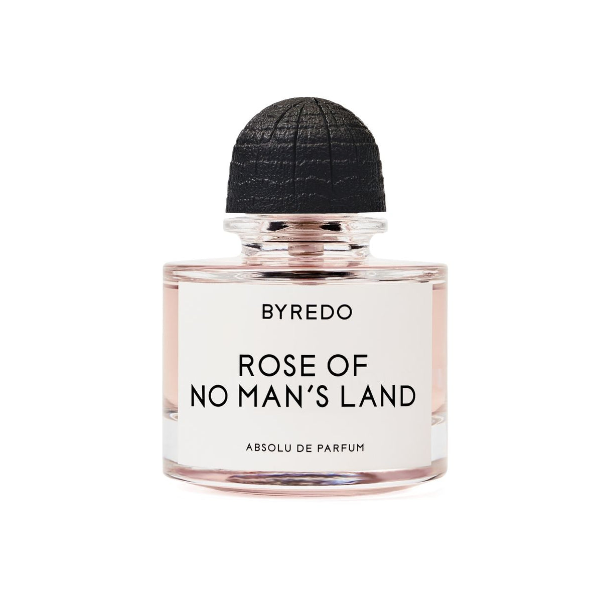 A clear glass perfume bottle with a round black cap containing pale pink liquid, featuring a white label for Byredo Rose of No Man’s Land Absolu de Parfum.