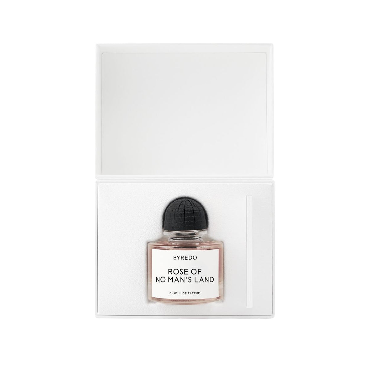 A glass bottle of Byredo Rose of No Man’s Land Absolu de Parfum with a round black cap inside an open white rectangular gift box.