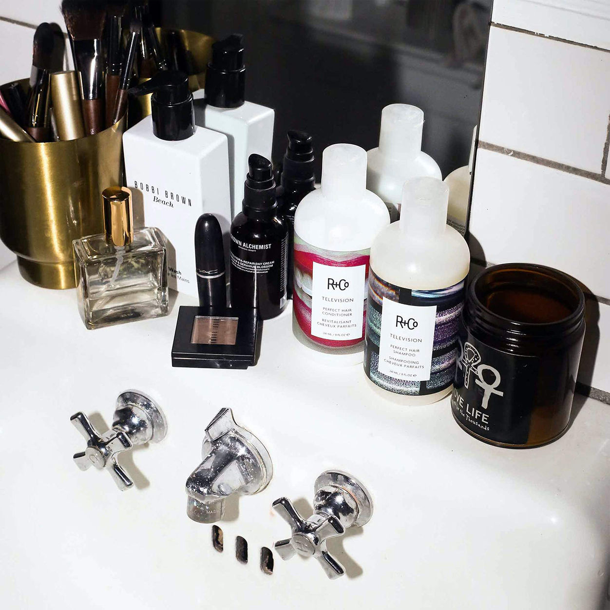 Lifestyle image of R+Co Television Perfect Hair Conditioner variant: 1.7 fl oz