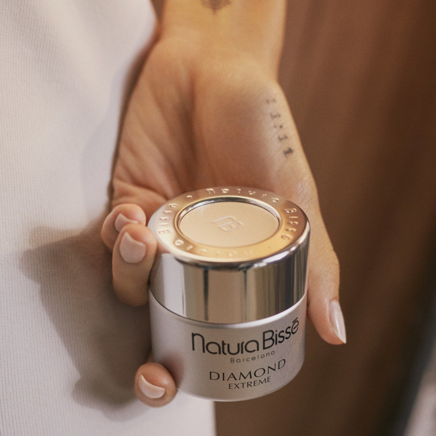 Lifestyle image of Natura Bissé Diamond Extreme Cream variant: 1.7 oz