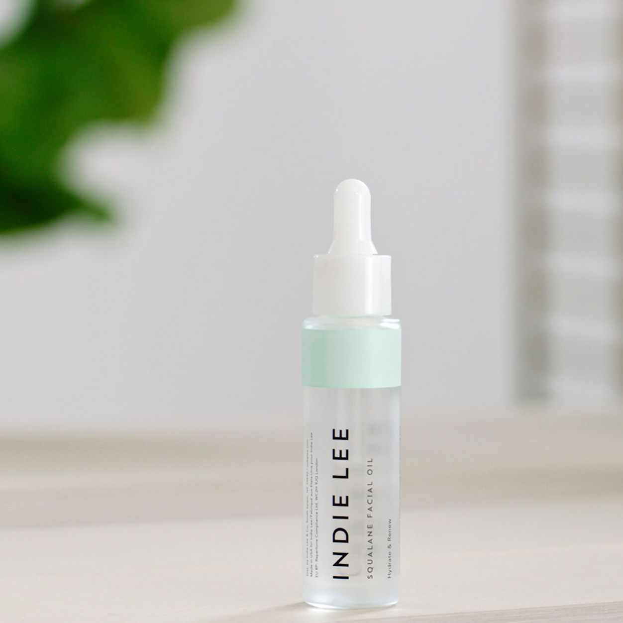 Lifestyle image of Indie Lee Squalane Facial Oil variant: 1 oz