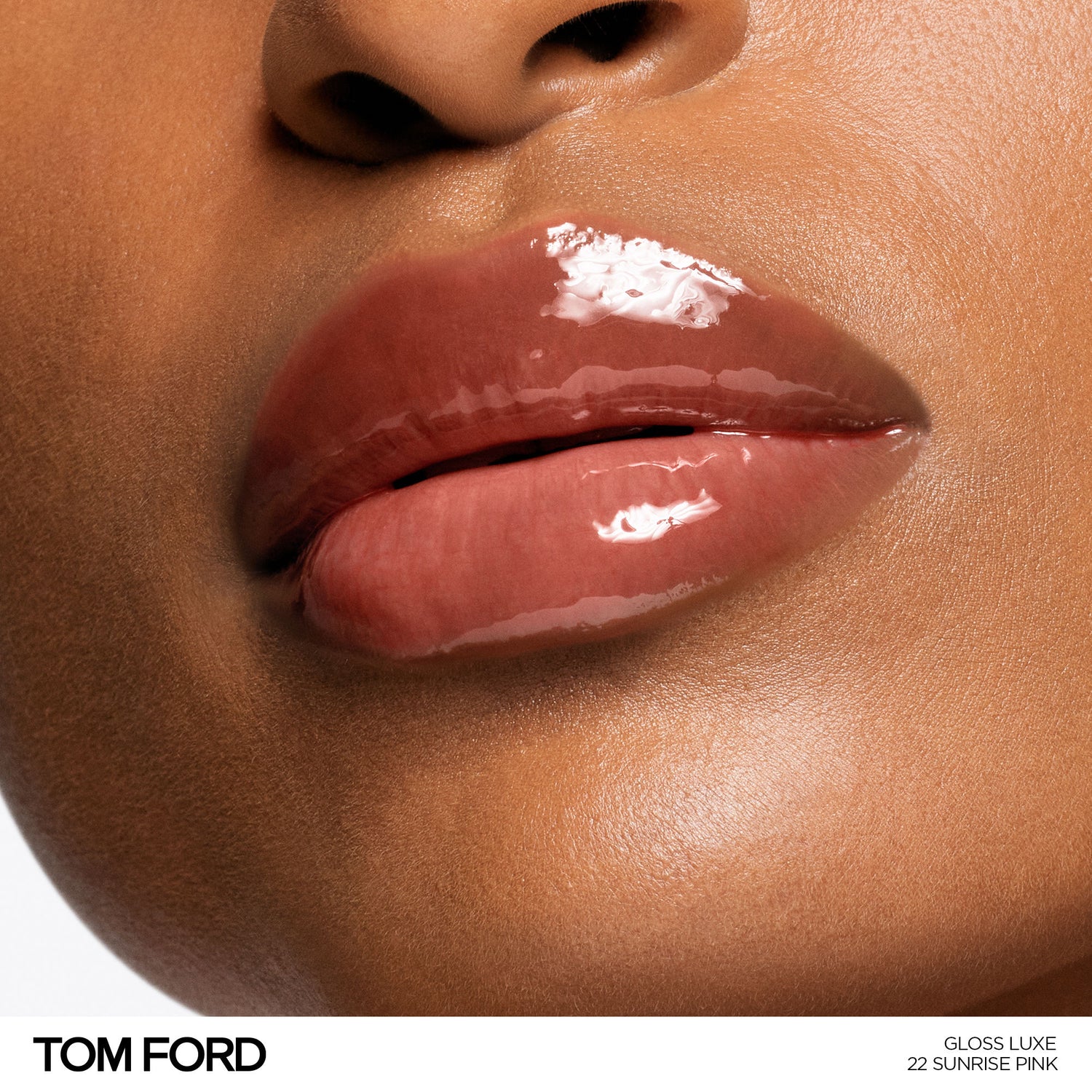 Model image of Tom Ford Gloss Luxe Lip with Hydrating Jojoba Oil variant: 22 SUNRISE PINK
