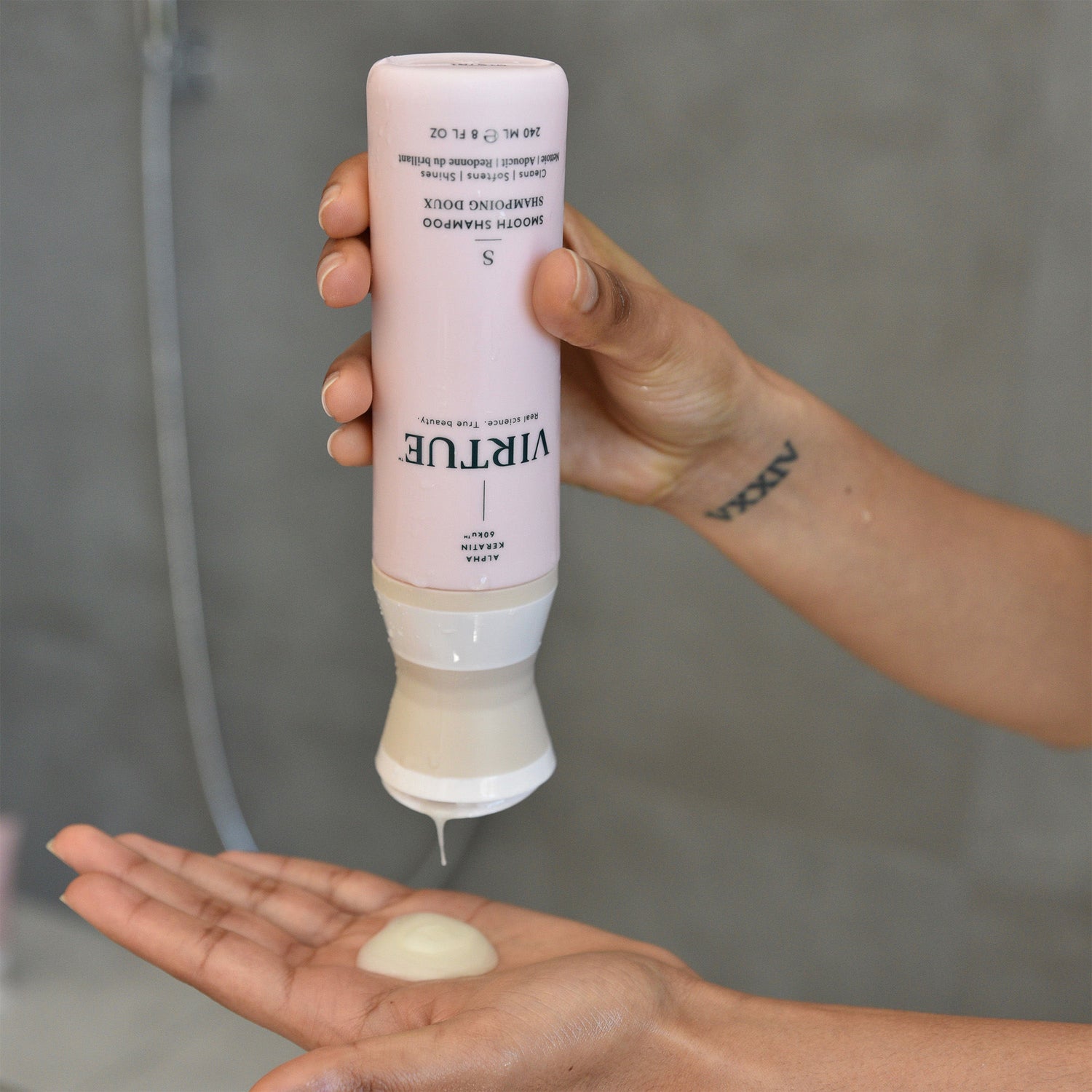 Lifestyle image of Virtue Smooth Shampoo variant: 2 oz