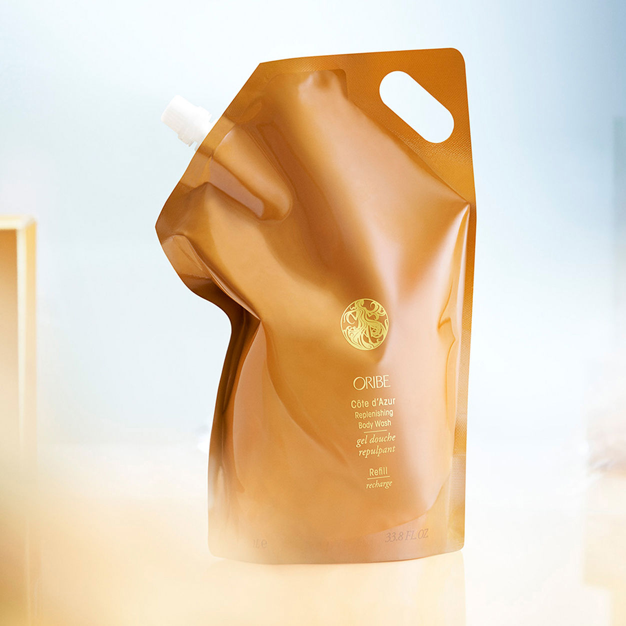 Image of an open Oribe Cote d'Azur Replenishing Body Wash variant: 33.8 fl oz (Refill)