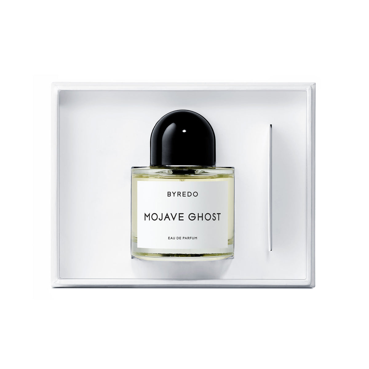 A Mojave Ghost Eau de Parfum woody fragrance bottle with a black cap and white label, centered in a white presentation box.