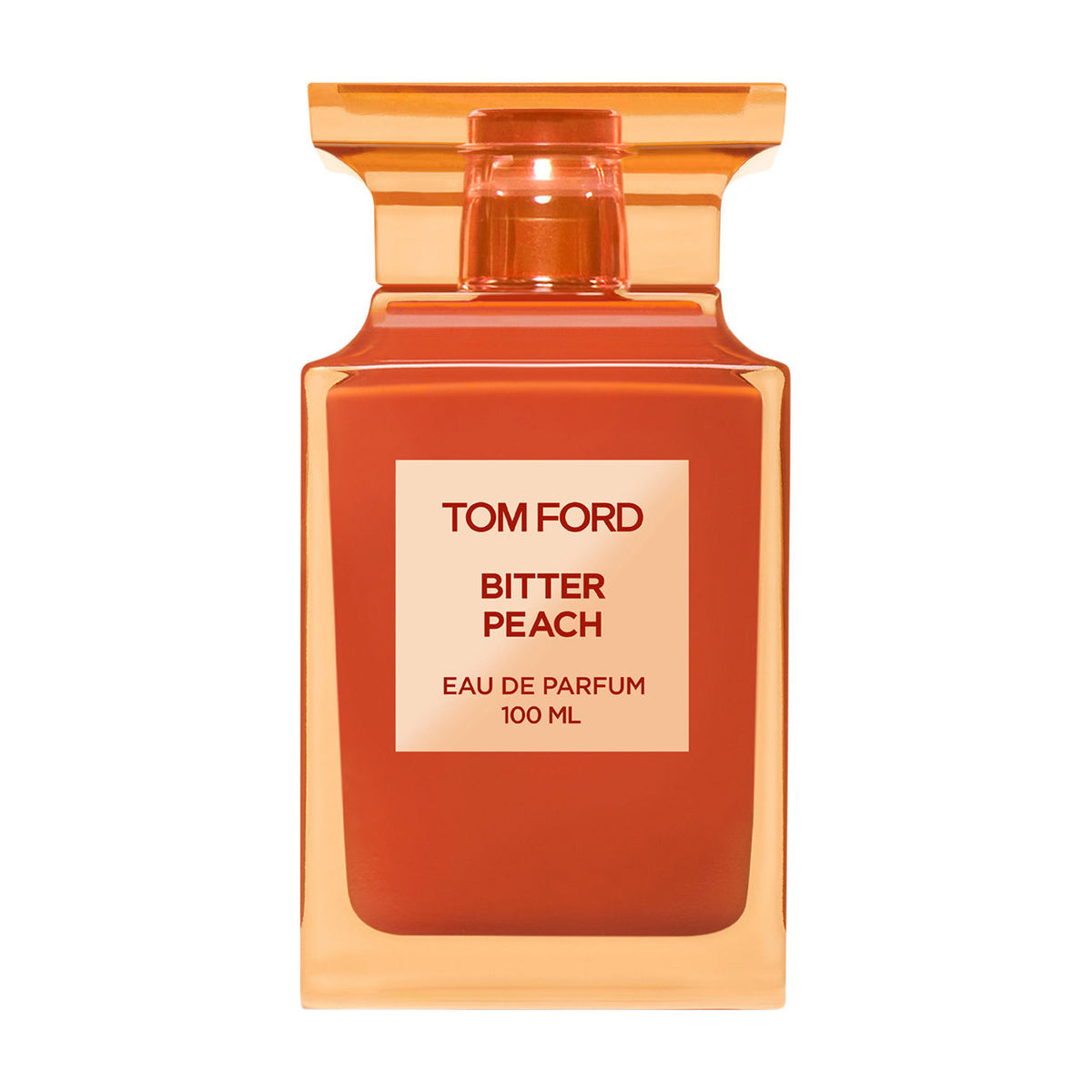 Square glass Tom Ford Bitter Peach Eau de Parfum bottle with a nectar-colored, orange-tinted cap and a label that reads 100 ML.