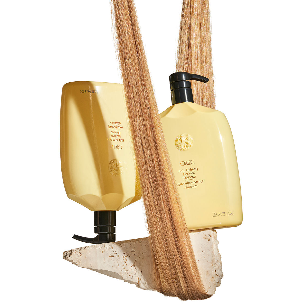 Lifestyle image of Oribe Hair Alchemy Resilience Shampoo variant: 33.8 fl oz