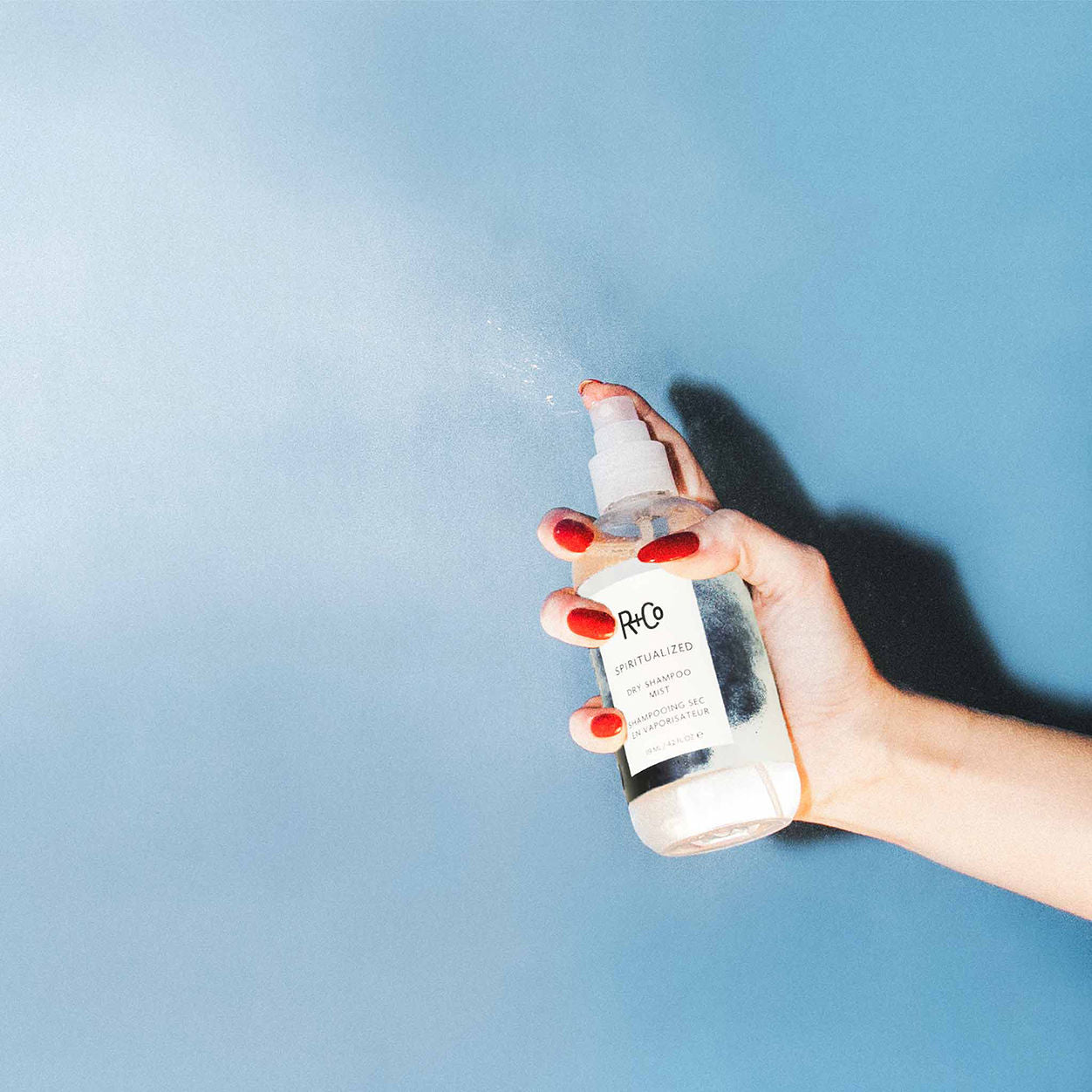 Lifestyle image of R+Co Spiritualized Dry Shampoo Mist variant: 4.2 oz
