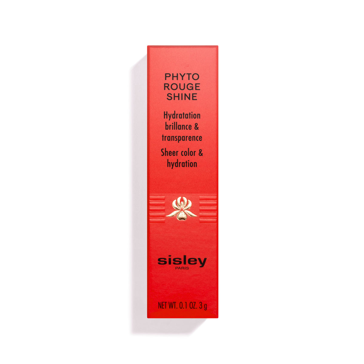 Red rectangular Phyto-Rouge Shine lipstick box featuring a central gold floral emblem and printed text detailing the product’s benefits, brand name, and net weight.
