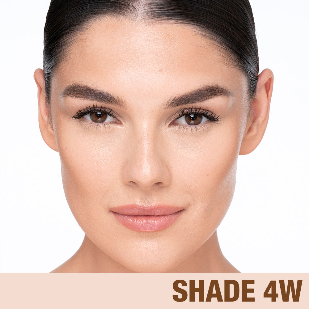 Model image of Charlotte Tilbury Charlotte's Beautiful Skin Foundation variant: 4 Warm (fair medium with warm yellow undertones)