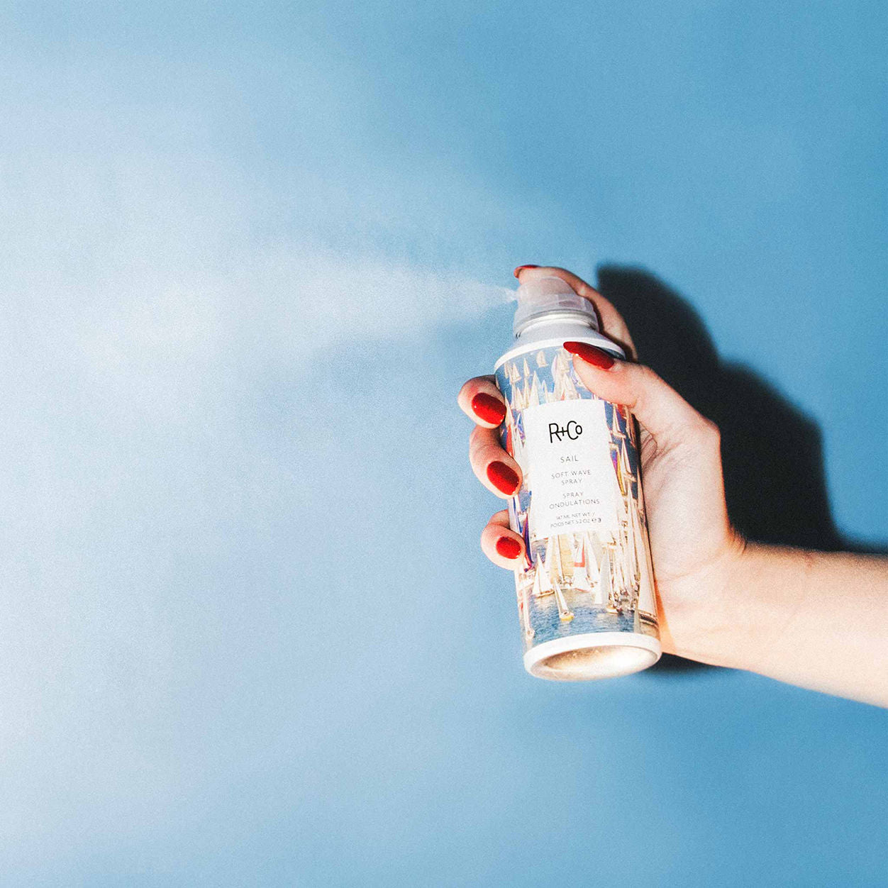 Lifestyle image of R+Co Sail Soft Wave Spray variant: 5.2 oz