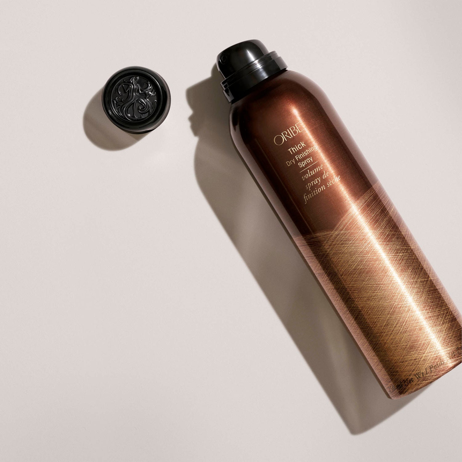 Lifestyle image of Oribe Thick Dry Finishing Spray variant: 7 oz