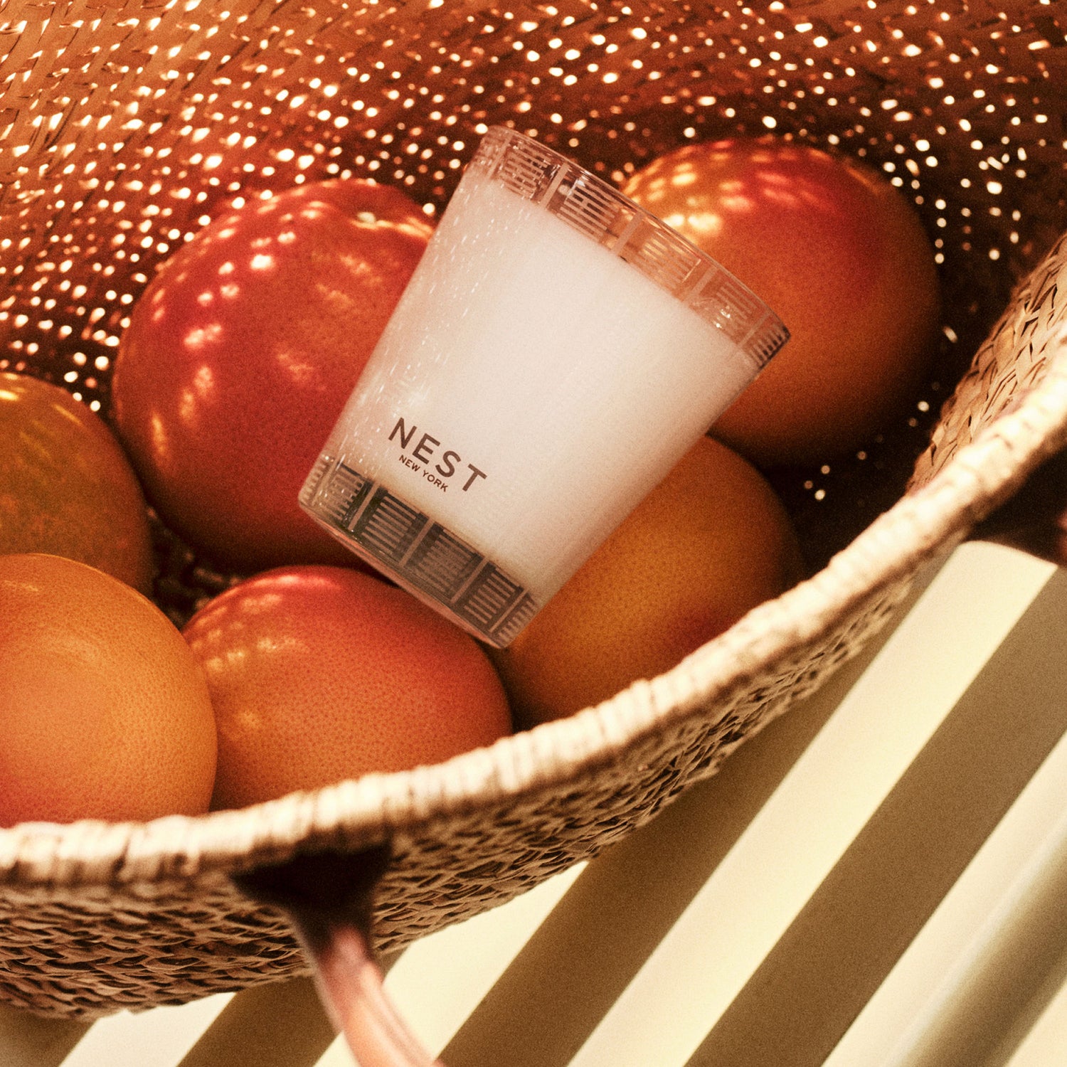Lifestyle image of Nest Grapefruit Candle variant: 8.1 oz (Classic)