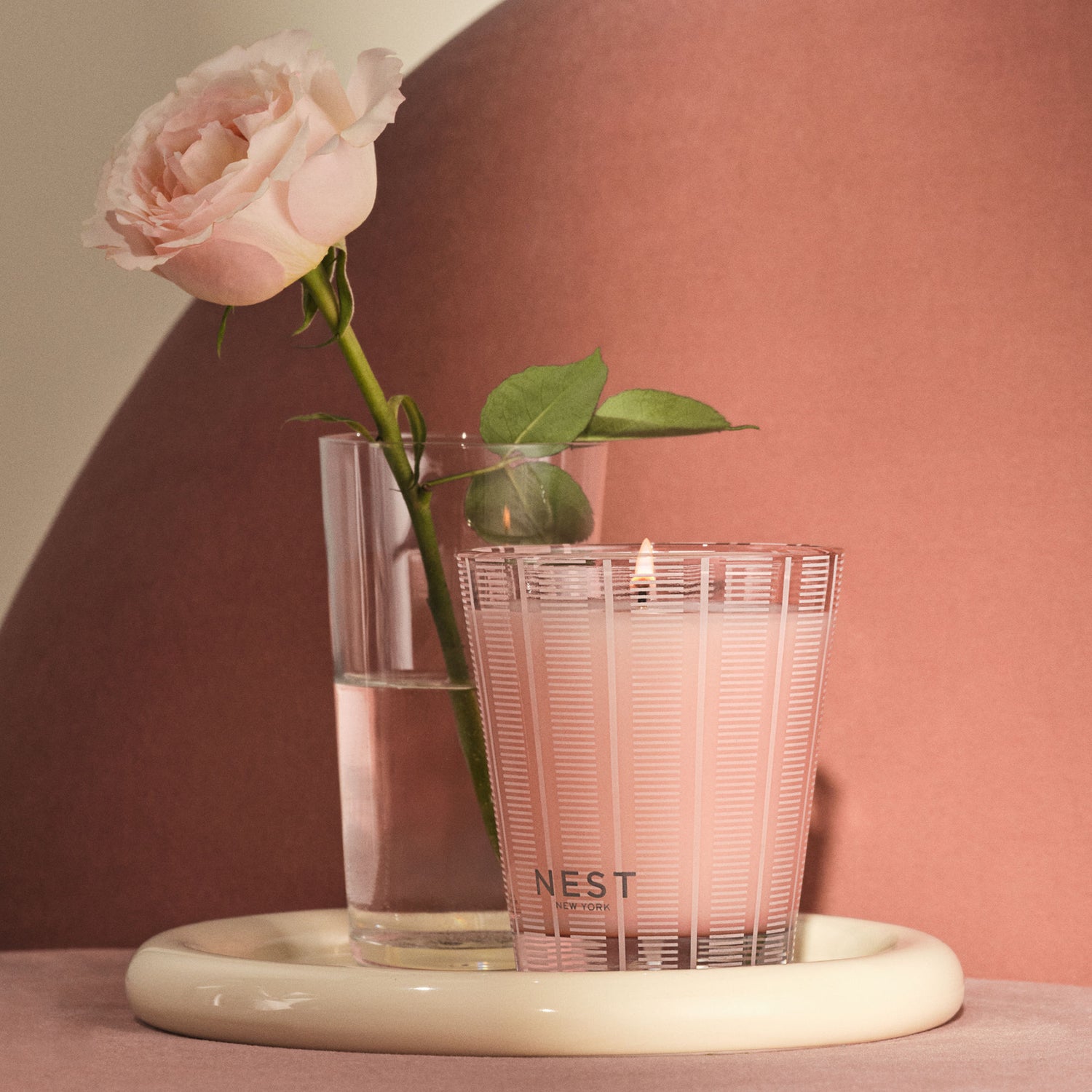 Lifestyle image of Nest Himalayan Salt & Rosewater Candle variant: 8.1 oz (Classic)