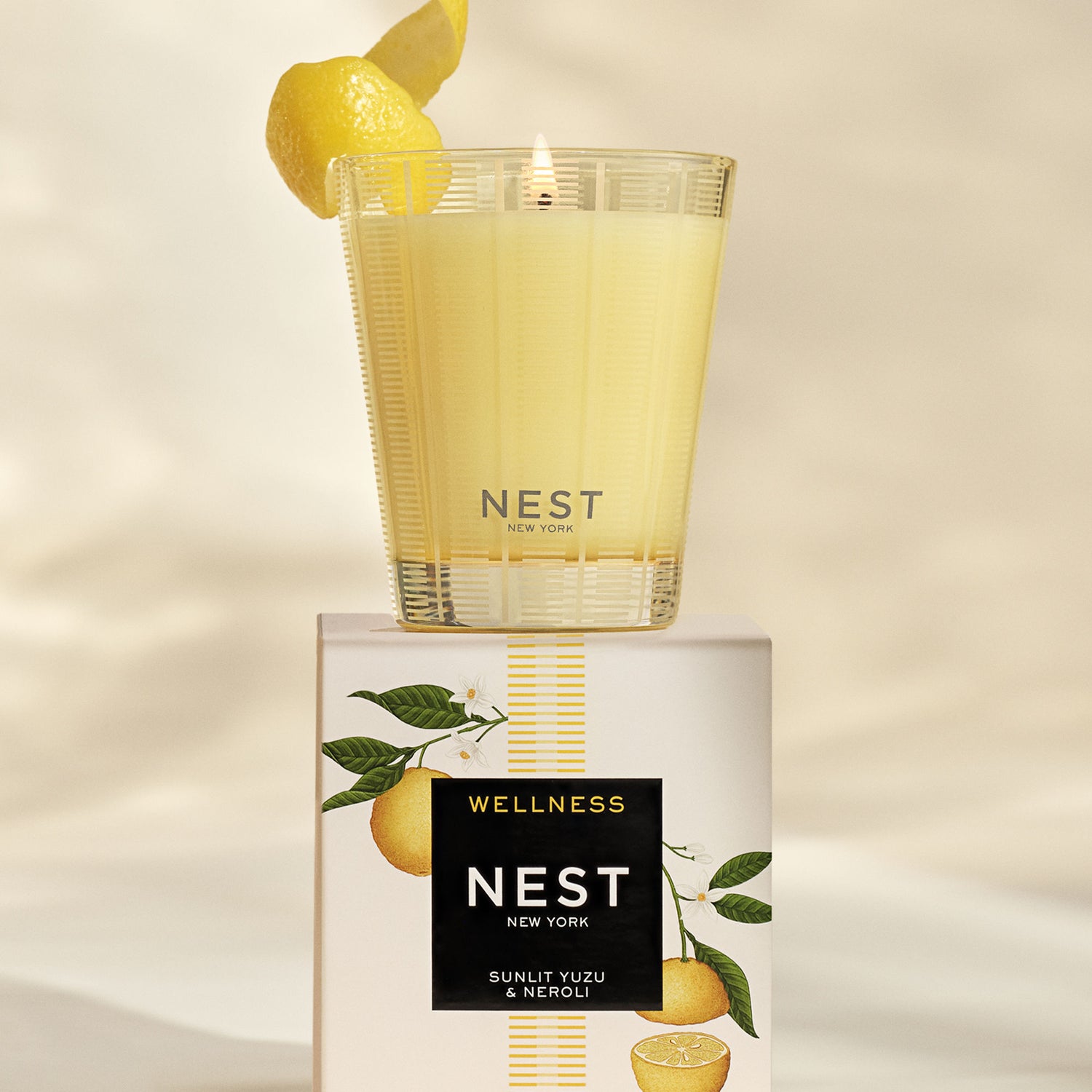 Lifestyle image of Nest Sunlit Yuzu & Neroli Candle variant: 8.1 oz (Classic)