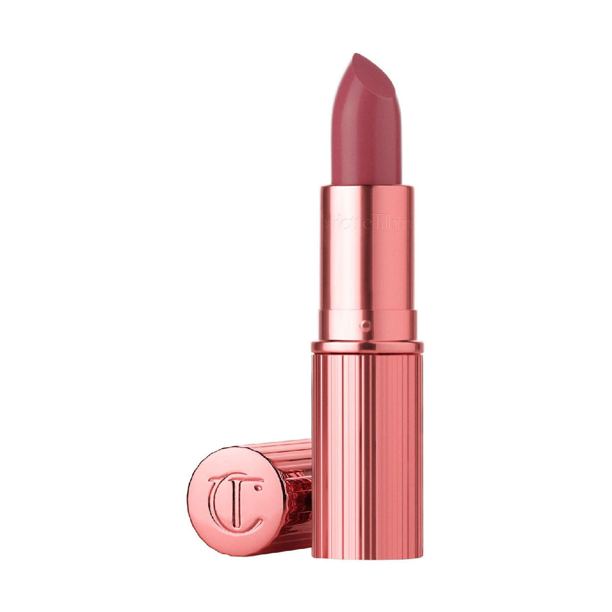 A K.I.S.S.I.N.G. Lipstick with a satin shine in a ribbed rose-gold tube with a matching cap lying beside it.