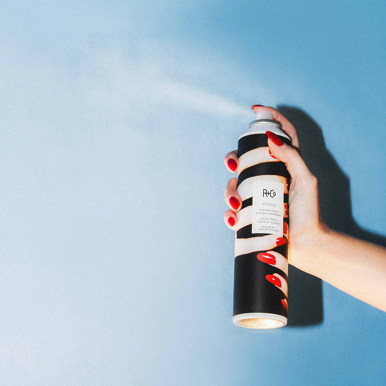 Lifestyle image of R+Co Vicious Strong Hold Flexible Hairspray variant: 9.5 oz