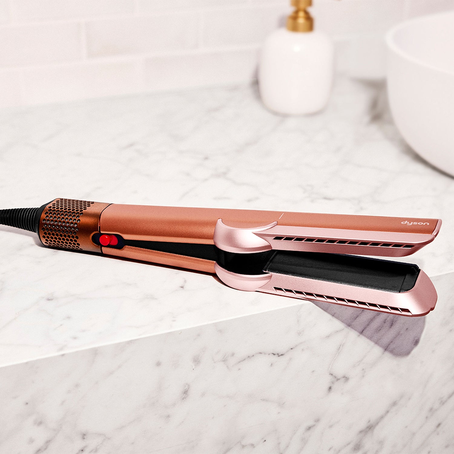 Lifestyle image of Dyson Airstrait Straightener variant: Amber Silk (Limited Edition)