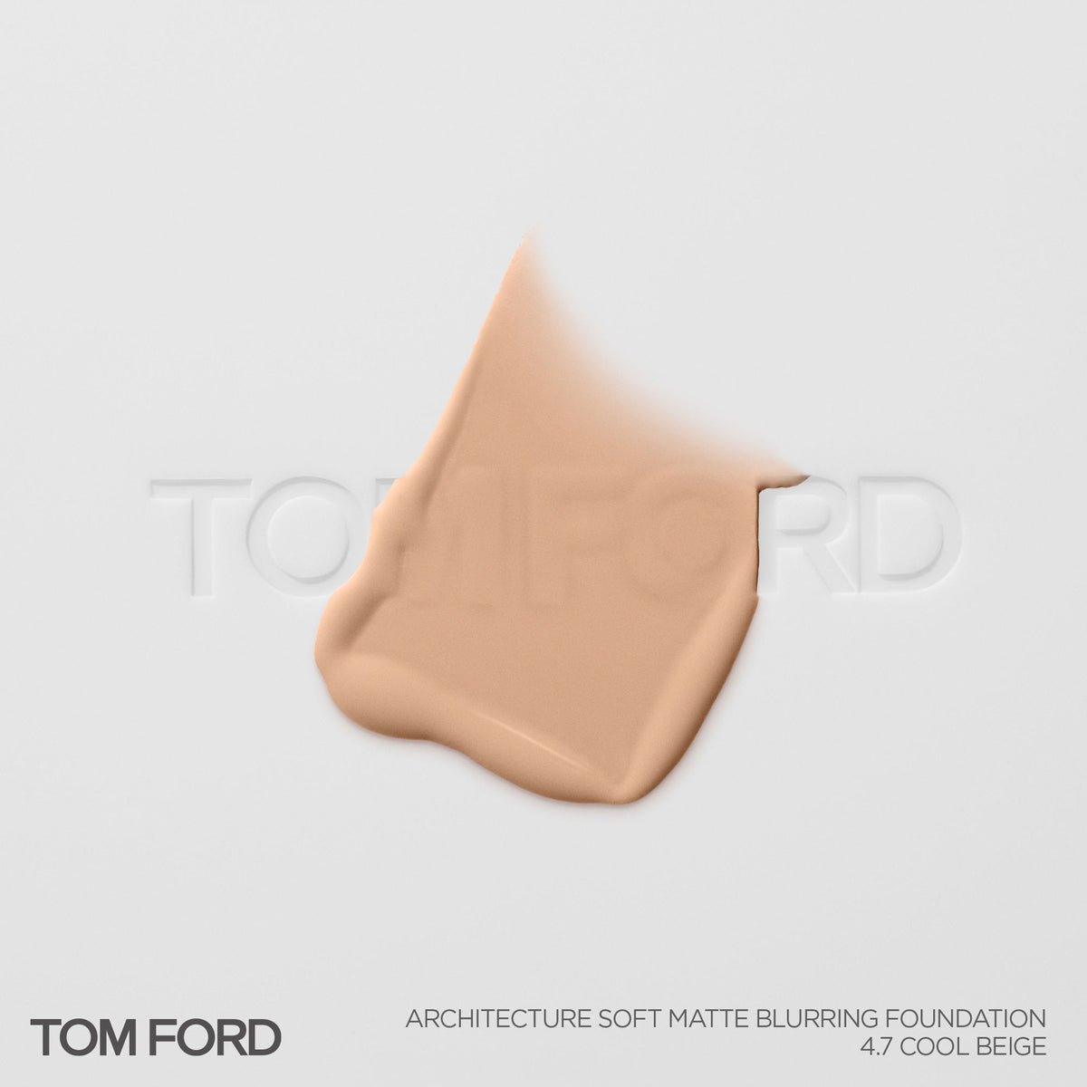 A smear of light beige Tom Ford Architecture Soft Matte Blurring Foundation on a white surface, providing a precision blur that perfects the skin.