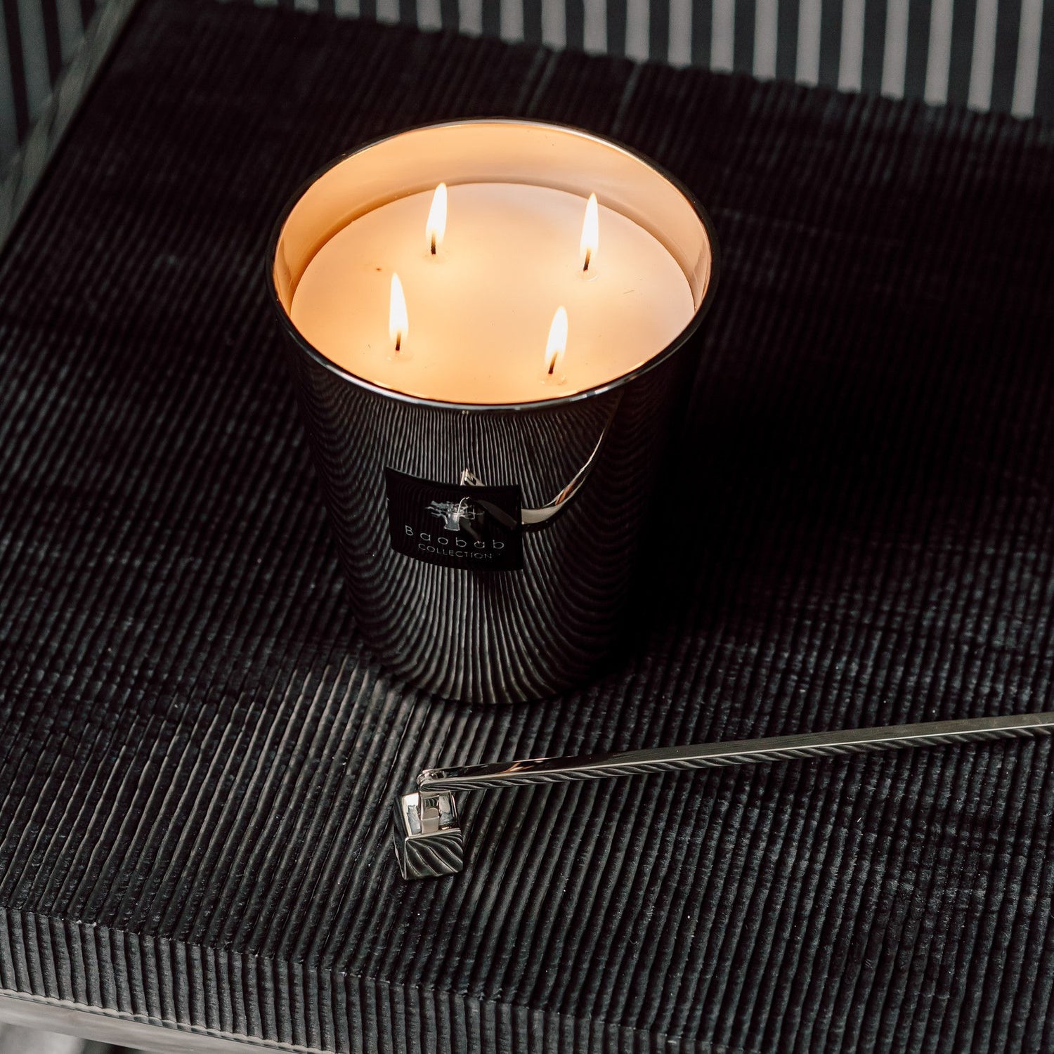 Lifestyle image of Baobab Collection Candle Snuffer variant: Silver