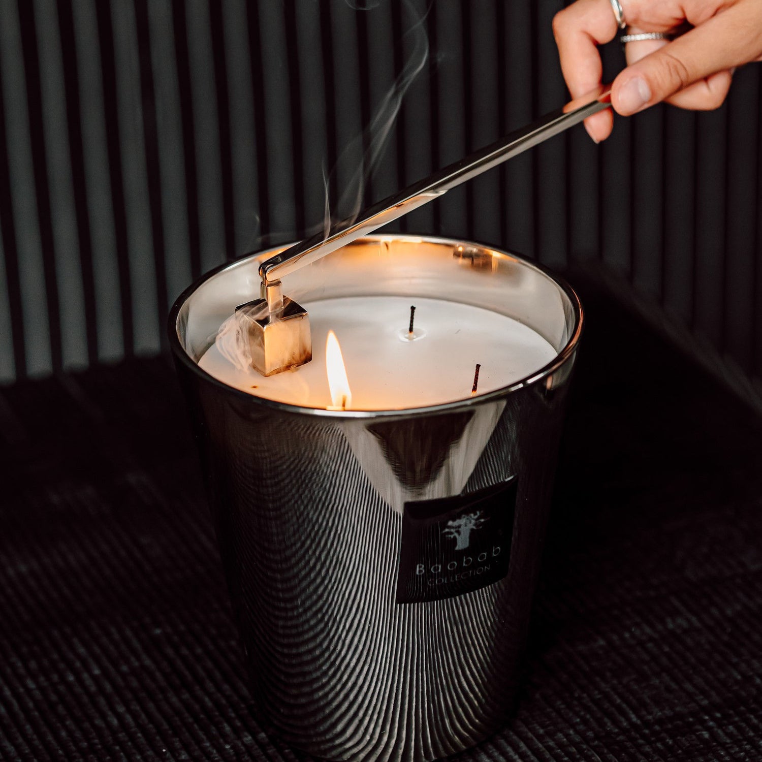 Lifestyle image of Baobab Collection Candle Snuffer variant: Silver