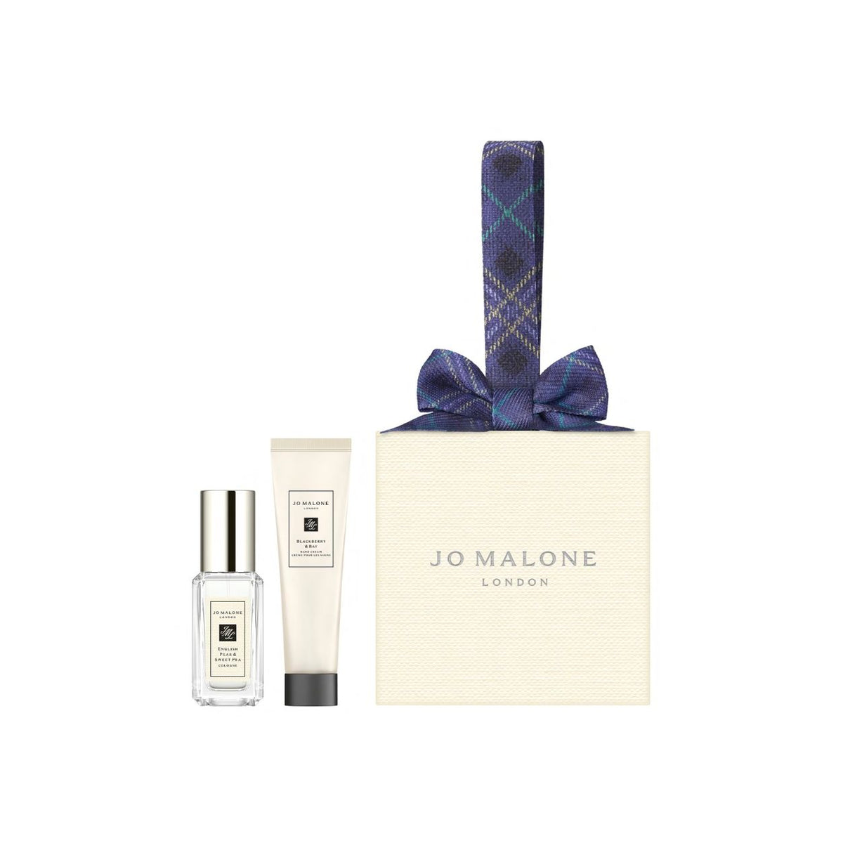 A Jo Malone London Fruity Cologne & Hand Cream Holiday Ornament Gift Set consisting of a travel-size cologne bottle, a tube of hand cream, and an ornament gift set box topped with a plaid ribbon loop.