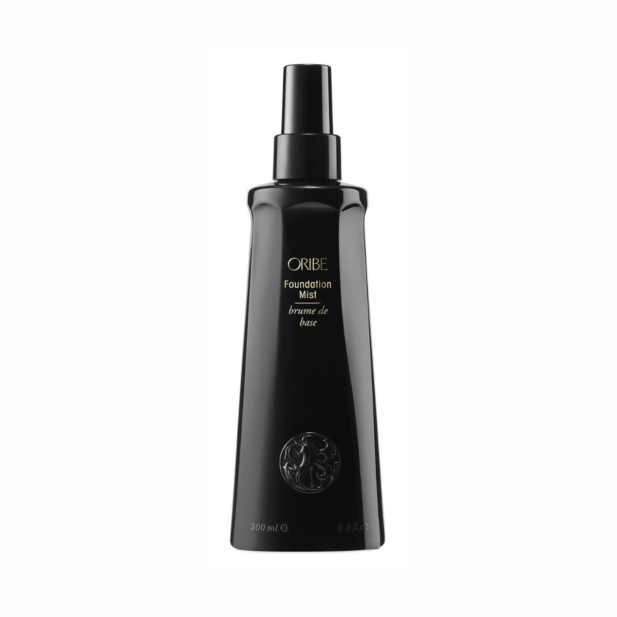 Black Oribe Foundation Mist Priming Spray bottle with a pump nozzle and circular emblem, formulated as a conditioning spray with thermal protection.