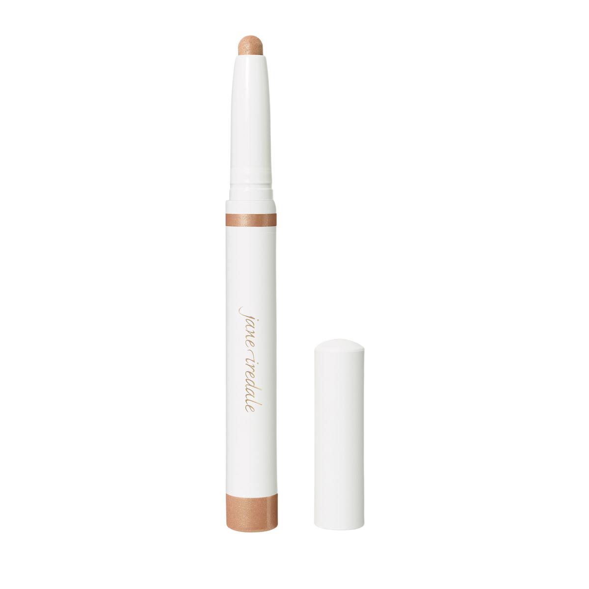 A champagne-colored Jane Iredale ColorLuxe Eye Shadow Stick with a white cap standing next to its removed lid.