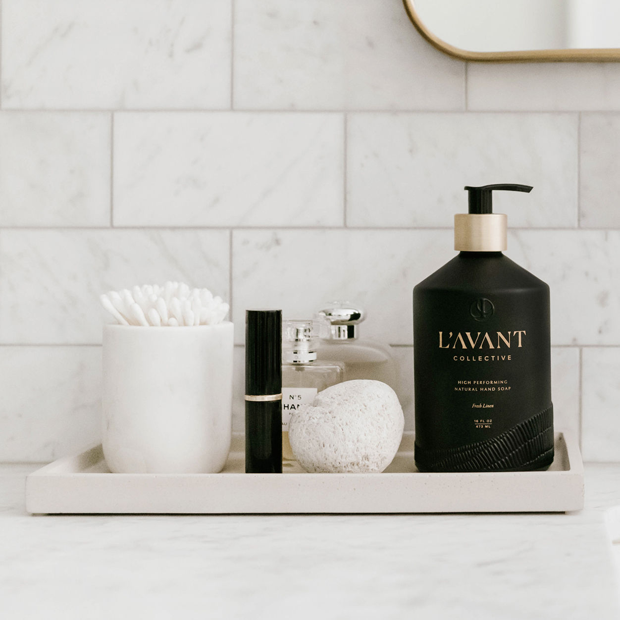 Lifestyle image of L’Avant Collective Fresh Linen Hand Soap variant: Glass Bottle (16 oz.)