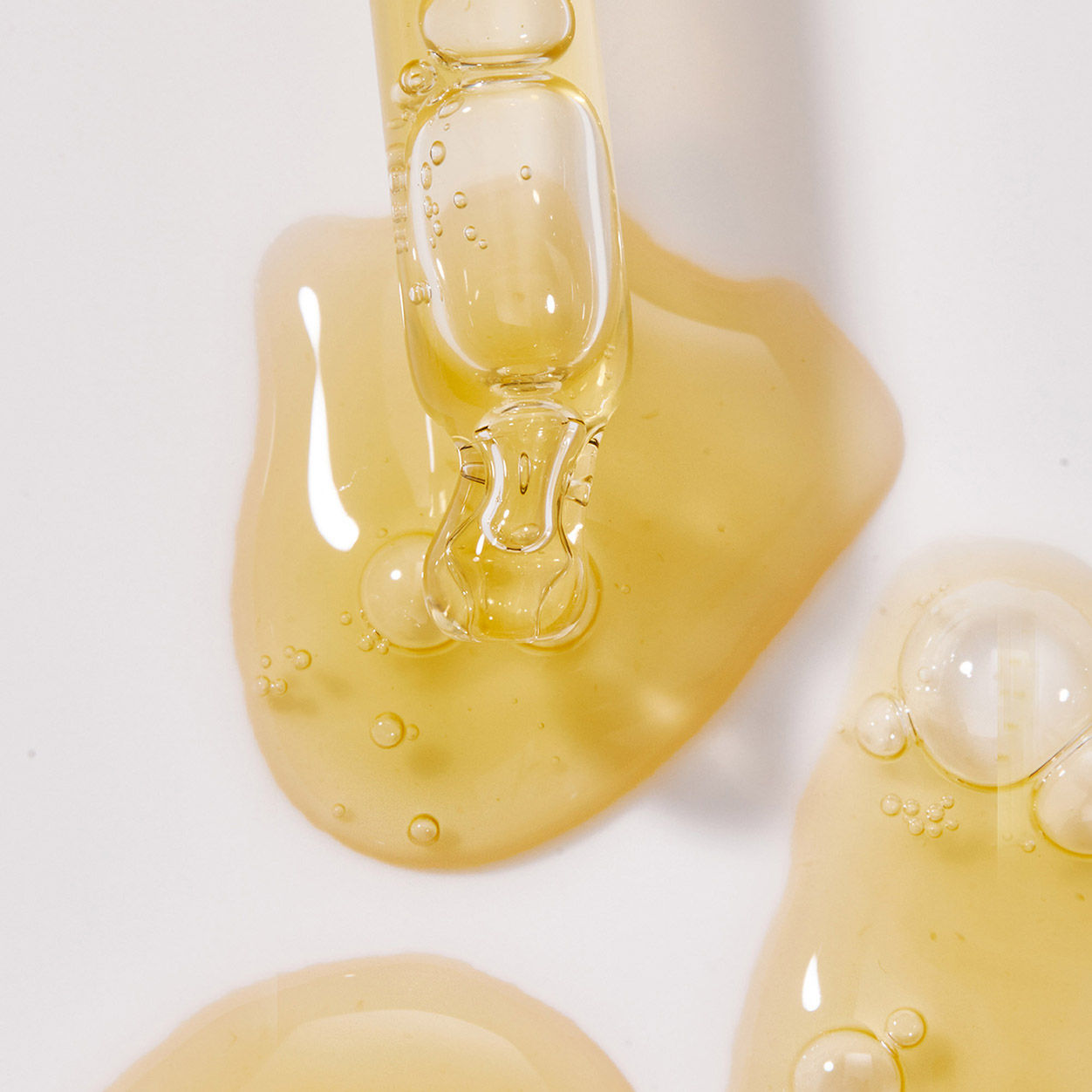 Lifestyle image of Tan-Luxe The Face Illuminating Self Tan Drops variant: Medium/Dark - 1 oz