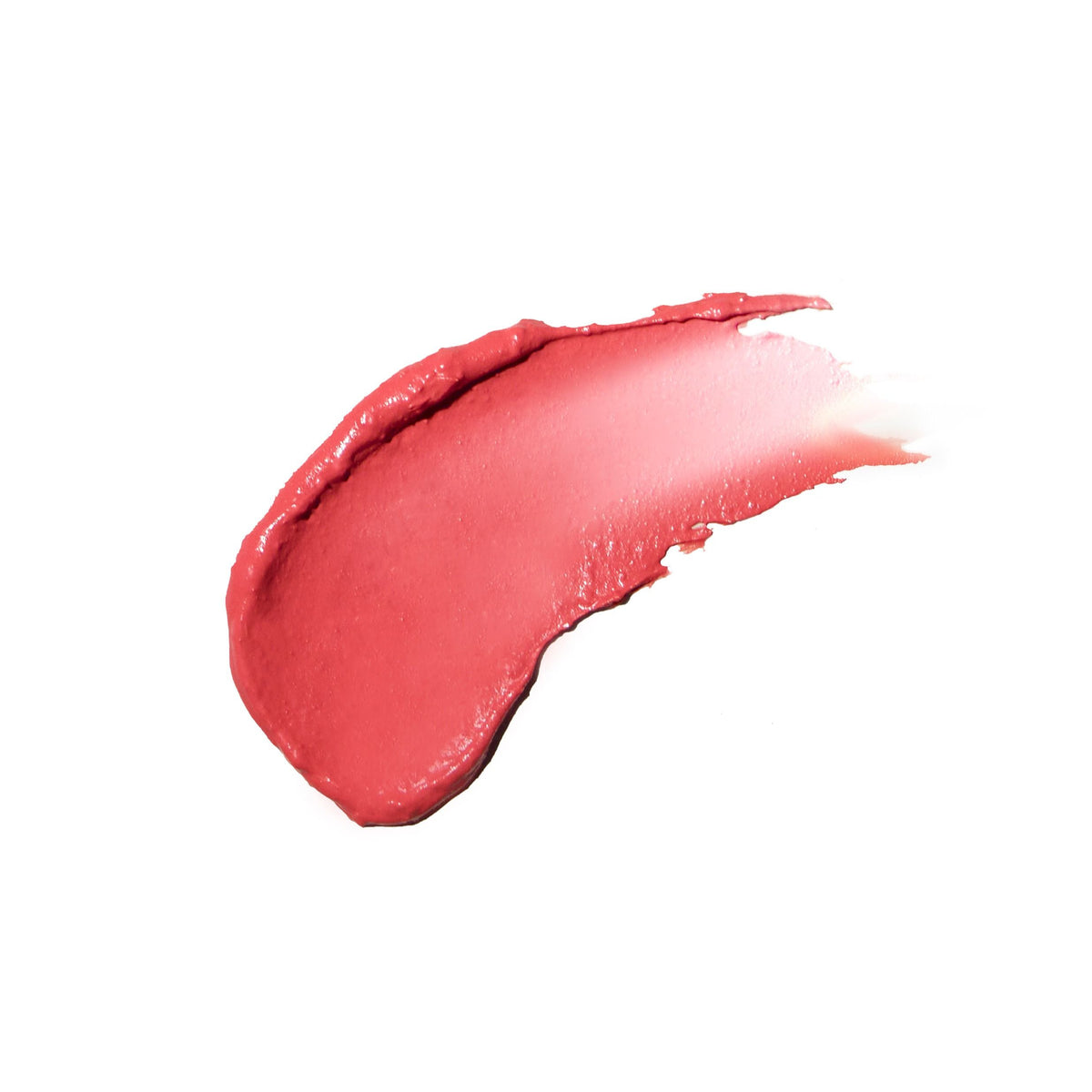 A thick, curved smear of Lune+Aster Cream Multi-Stick in a coral pink shade.