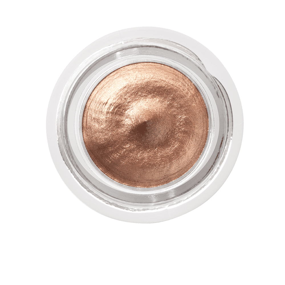 A top-down view of a glass jar filled with Charlotte Tilbury Eyes To Mesmerise, a long-lasting, metallic copper cream eyeshadow.
