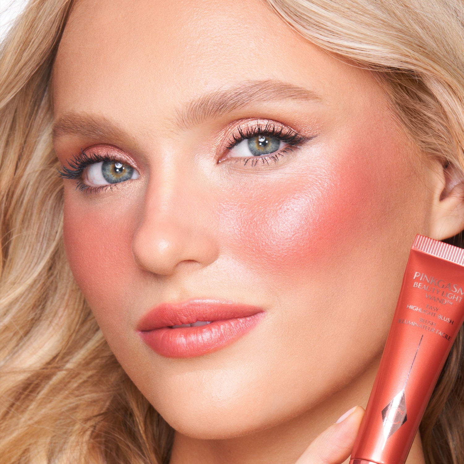Model image of Charlotte Tilbury Beauty Light Wand variant: Pinkgasm Sunset