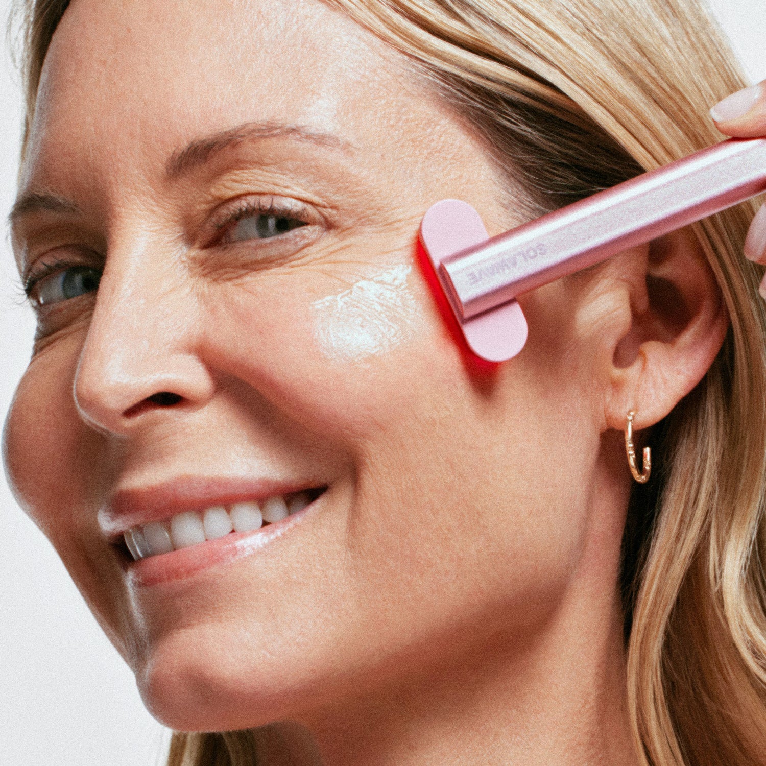 Model image of Solawave Advanced Skincare Wand With Red Light Therapy variant: Rose Gold