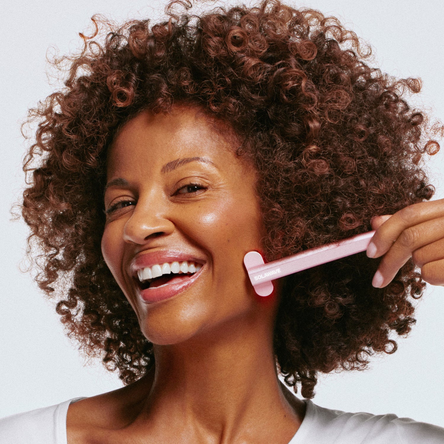 Model image of Solawave Advanced Skincare Wand With Red Light Therapy variant: Rose Gold