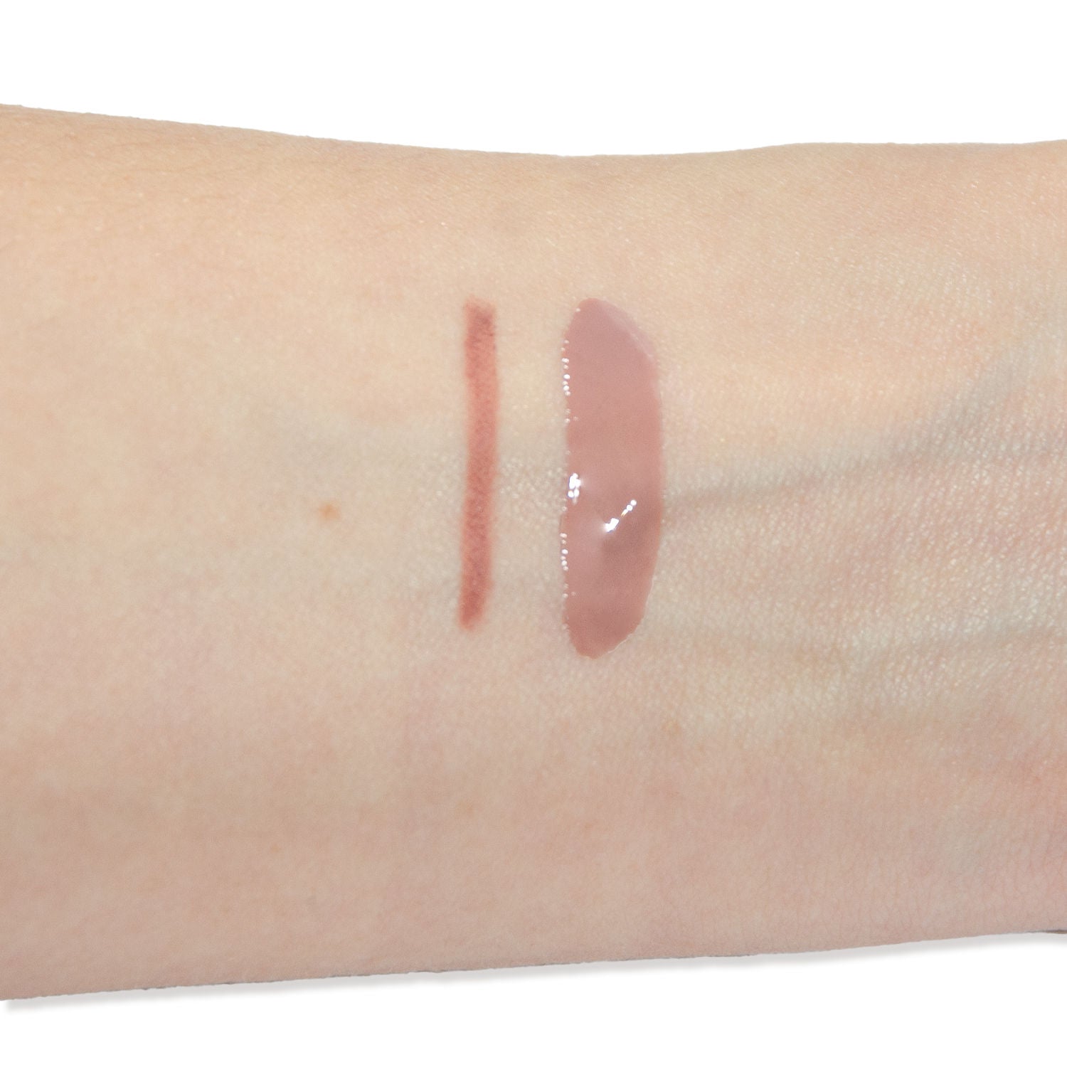 An arm swatch of Neen Silicone Bag + Charms Lip Gloss and Liner Combo (Limited Edition) variant: Spring and Malt