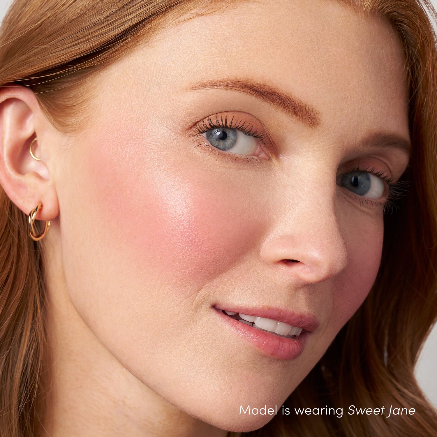 Model image of Jane Iredale ColorLuxe Liquid Blush variant: Sweet Jane