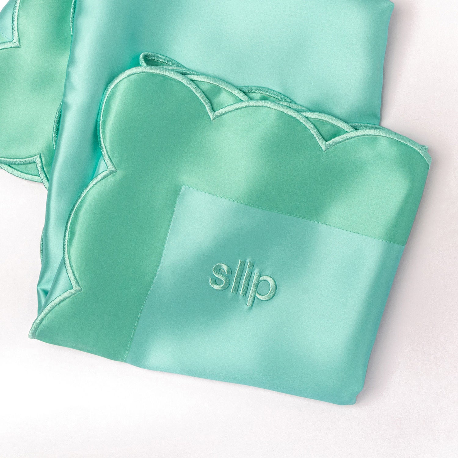 Top-view image of Slip Pure Silk Queen Pillowcase with Scalloped Edge variant: Turquoise (Limited Edition)