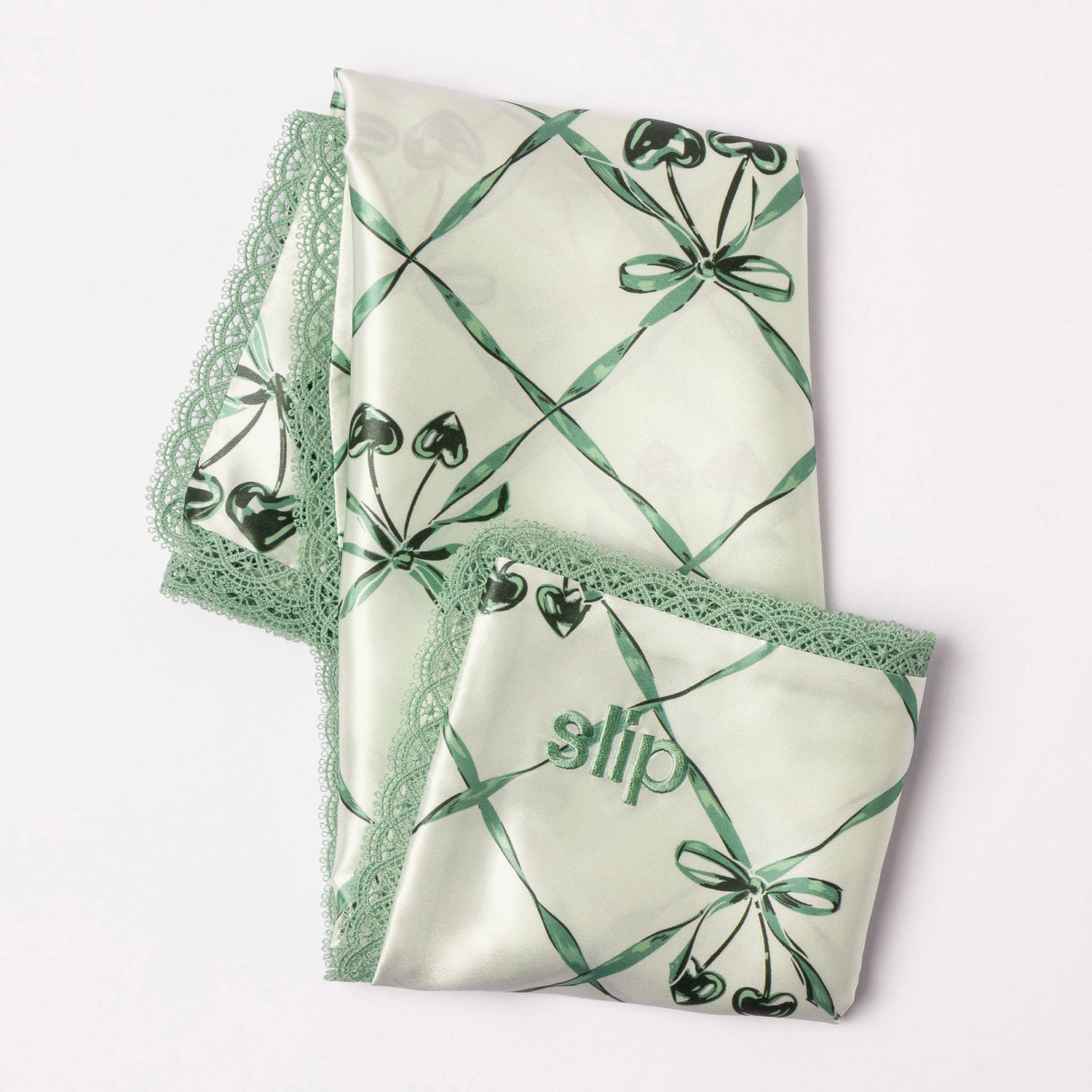 Top-view image of Slip Pure Silk Queen Pillowcase with Lace Trim (Limited Edition) variant: Wintergreen