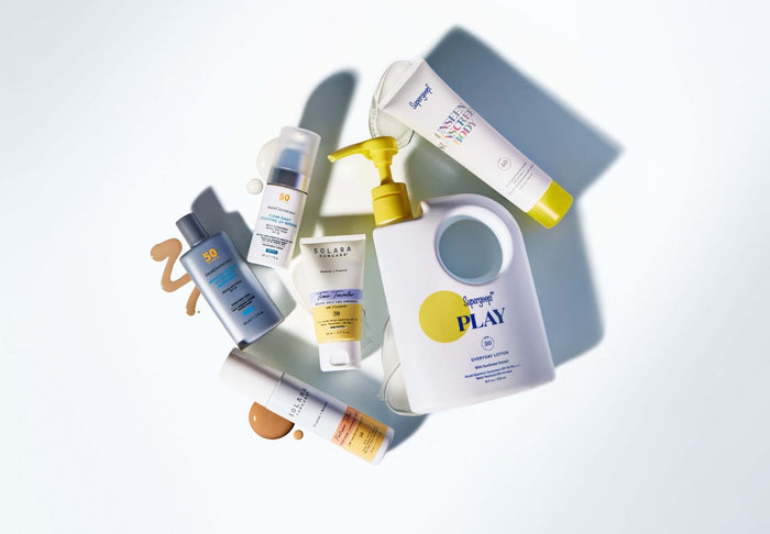 sunscreen bottles on white background