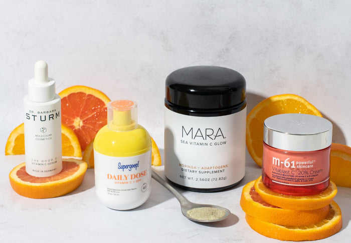 vitamin c products in front of orange slices