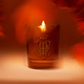 Lifestyle image of Sisley Paris Wood and Orange Zest Candle